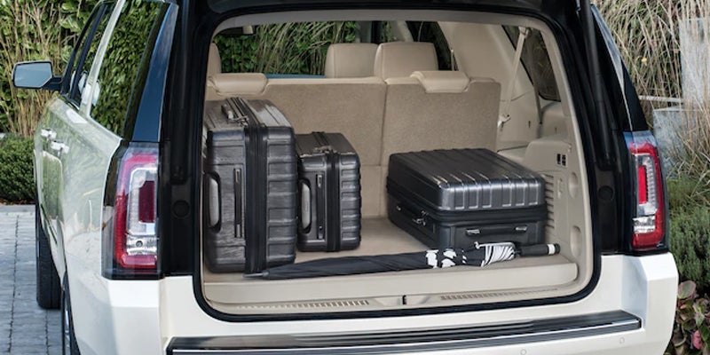 white GMC YUKON suitcases in the bag