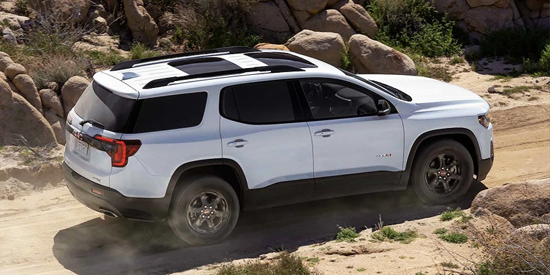 white GMC ACADIA in desert road