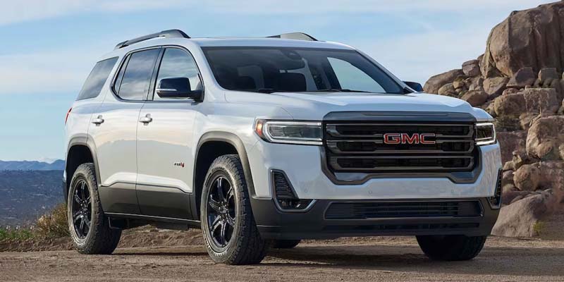 white GMC ACADIA in desert road